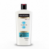 Glam & Curious Smooth & Silky Shampoo bottle with sleek packaging, designed for shiny, silky hair.