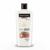 Glam & Curious keratin hair shampoo bottle with label, showcasing a smooth, healthy hair care product for frizz control and shine.